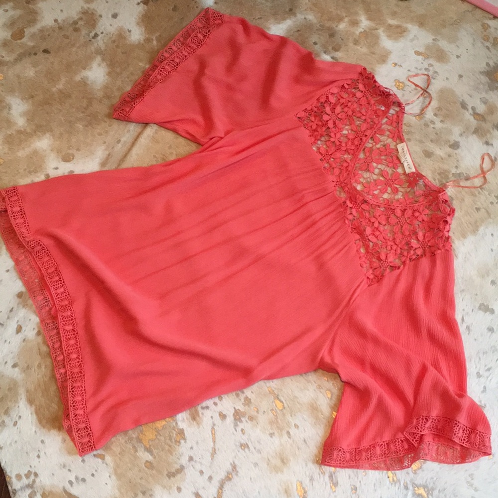 Coral shift dress with crochet details